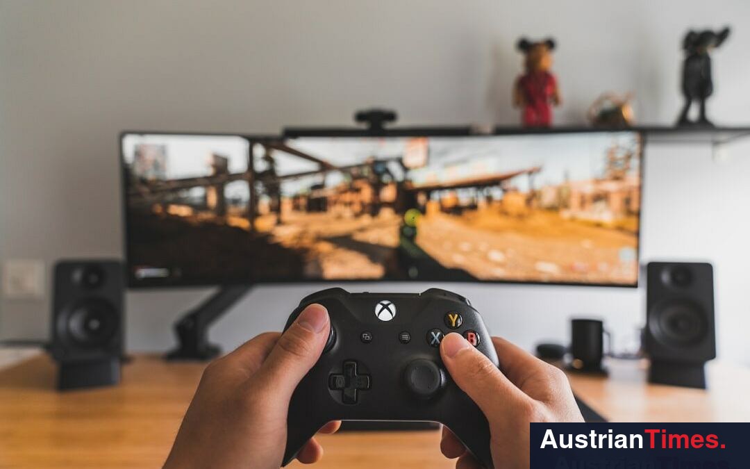 person holding black game controller person holding black game controller
