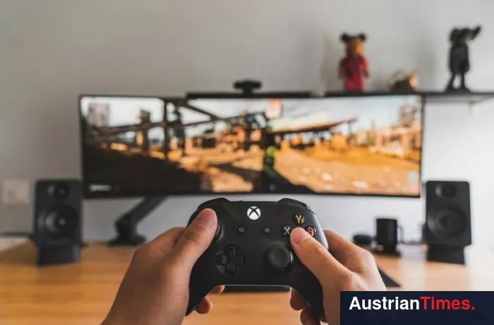 person holding black game controller
